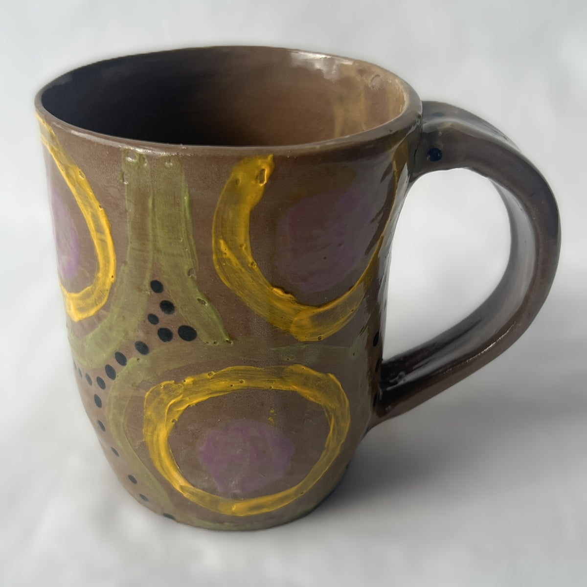 Brown Ceramic Mug with Purple Yellow and Green Bullseye Design