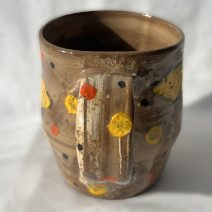 brown Ceramic mug with lemon design on a white background