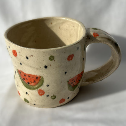 Ceramic mug with watermelon design on a white background
