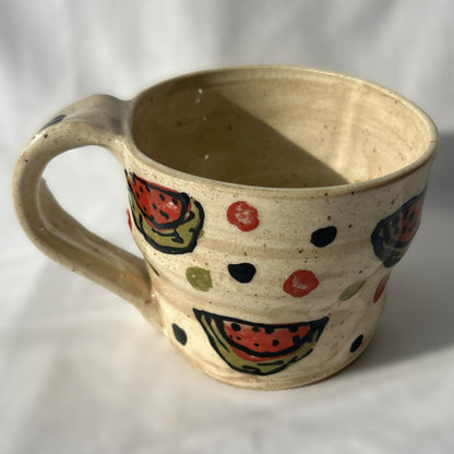 Ceramic mug with watermelon pattern on a white background