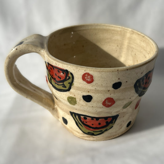 Ceramic mug with watermelon pattern on a white background