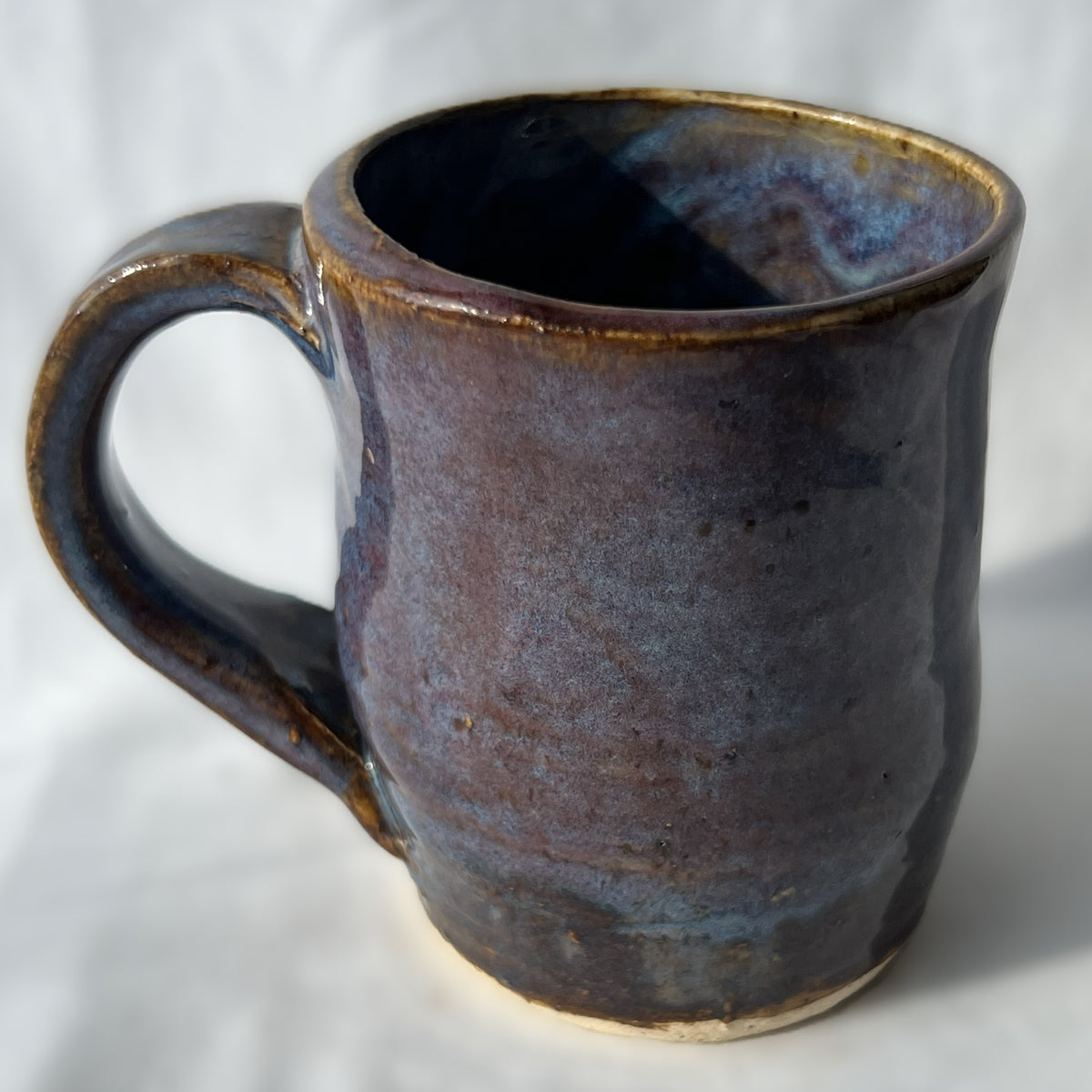 Ceramic Mug with a smooth brown purple surface