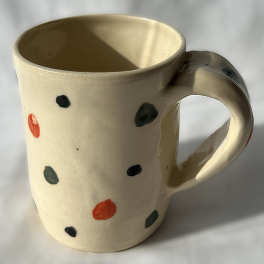 Ceramic mug with wreath design on a White background