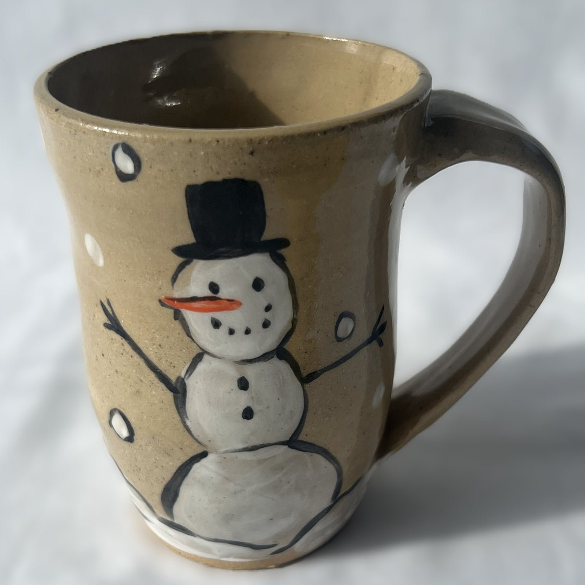 Tan Ceramic Mug with a Snowman design