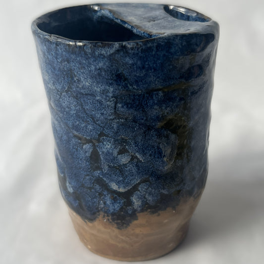Blue and Brown Handle less ceramic tumbler with a partial lid