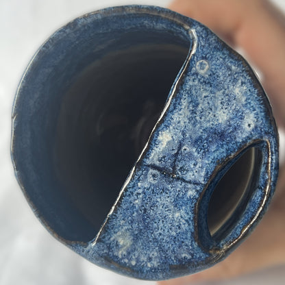 Blue and Brown Handle less ceramic tumbler with a partial lid
