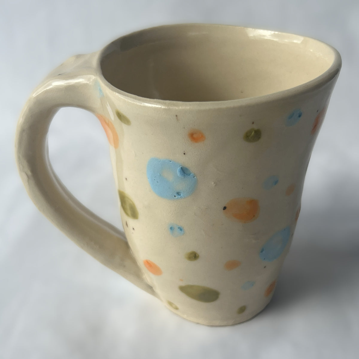 White Ceramic Mug with Orange, Green and Blue Polka Dot Design