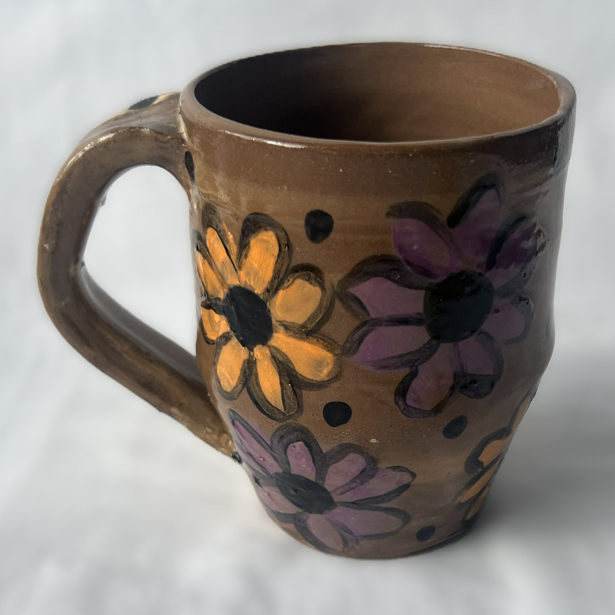Brown Ceramic Mug with Orange and Purple Flower Design