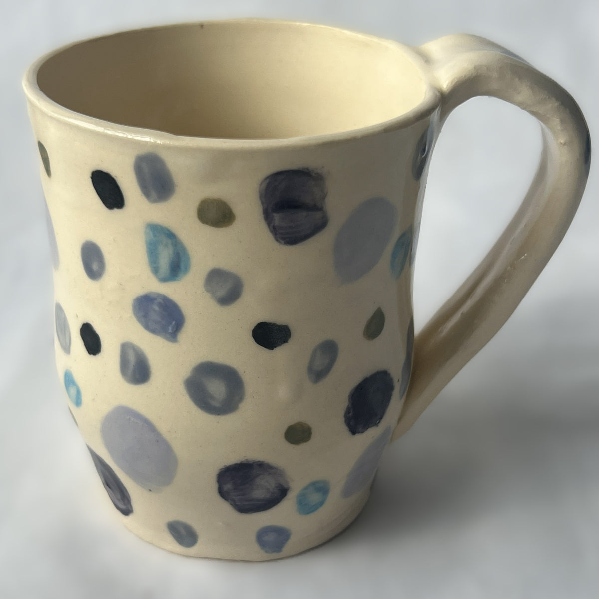 White Ceramic Mug with Purple and Blue Polka Dot Design