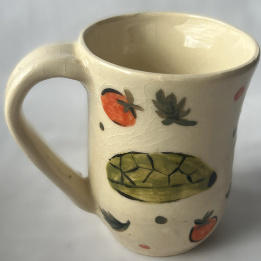 White Ceramic Mug with a drawing of a turtle eating a cherry tomato design