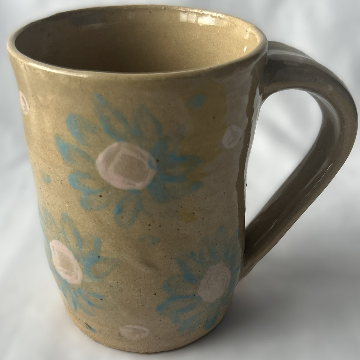 Tan Ceramic Mug with Light Blue Flower Design