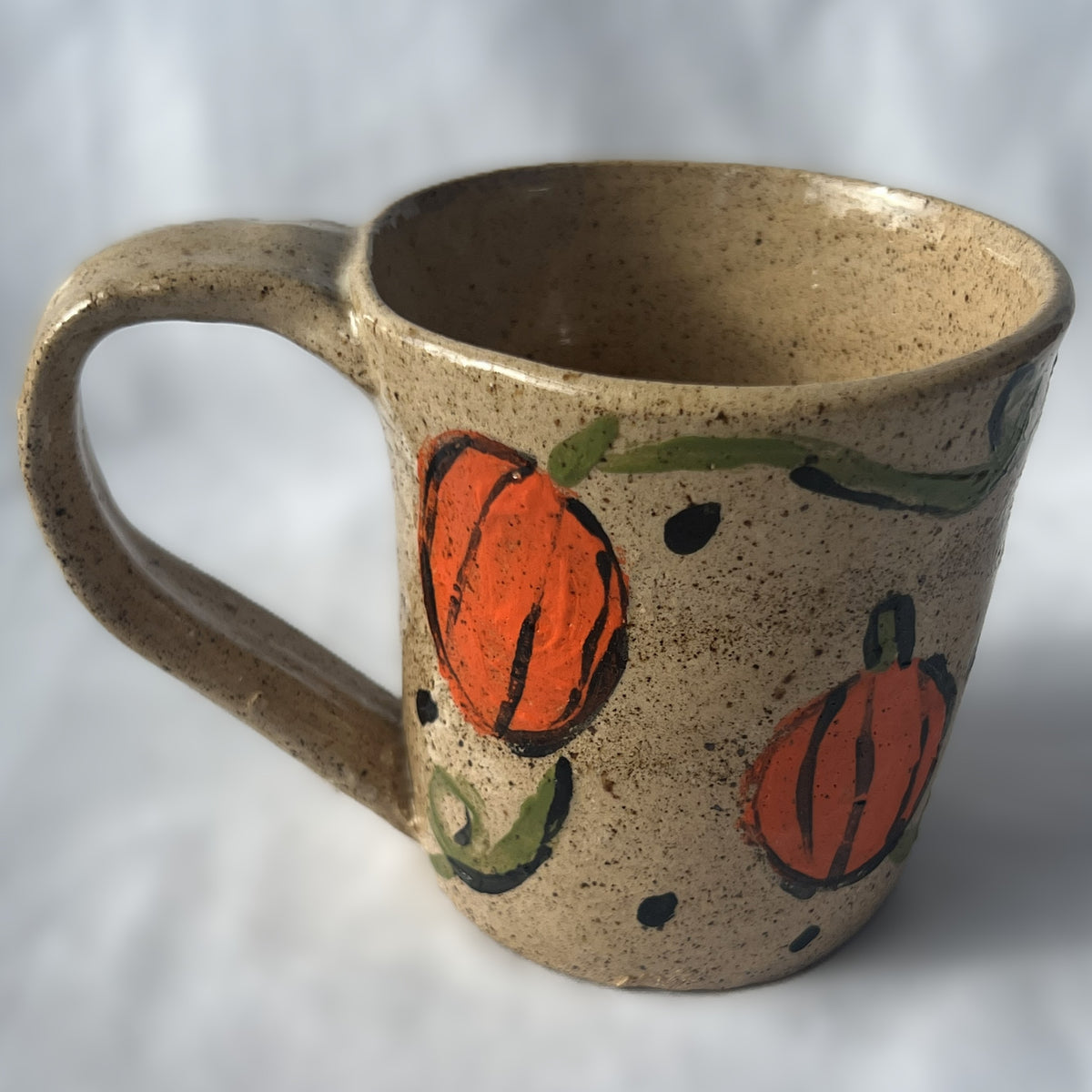Brown Speckled Ceramic Mug with a Pumpkin Design