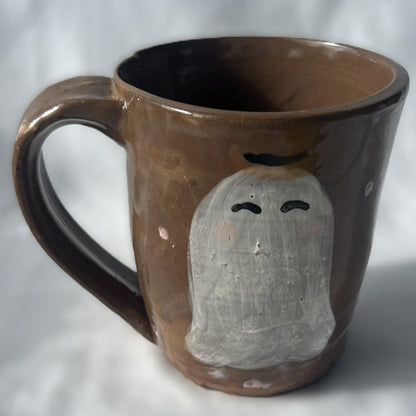 Brown Ceramic Mug with Drawn Ghost in a Cowboy Hat Design