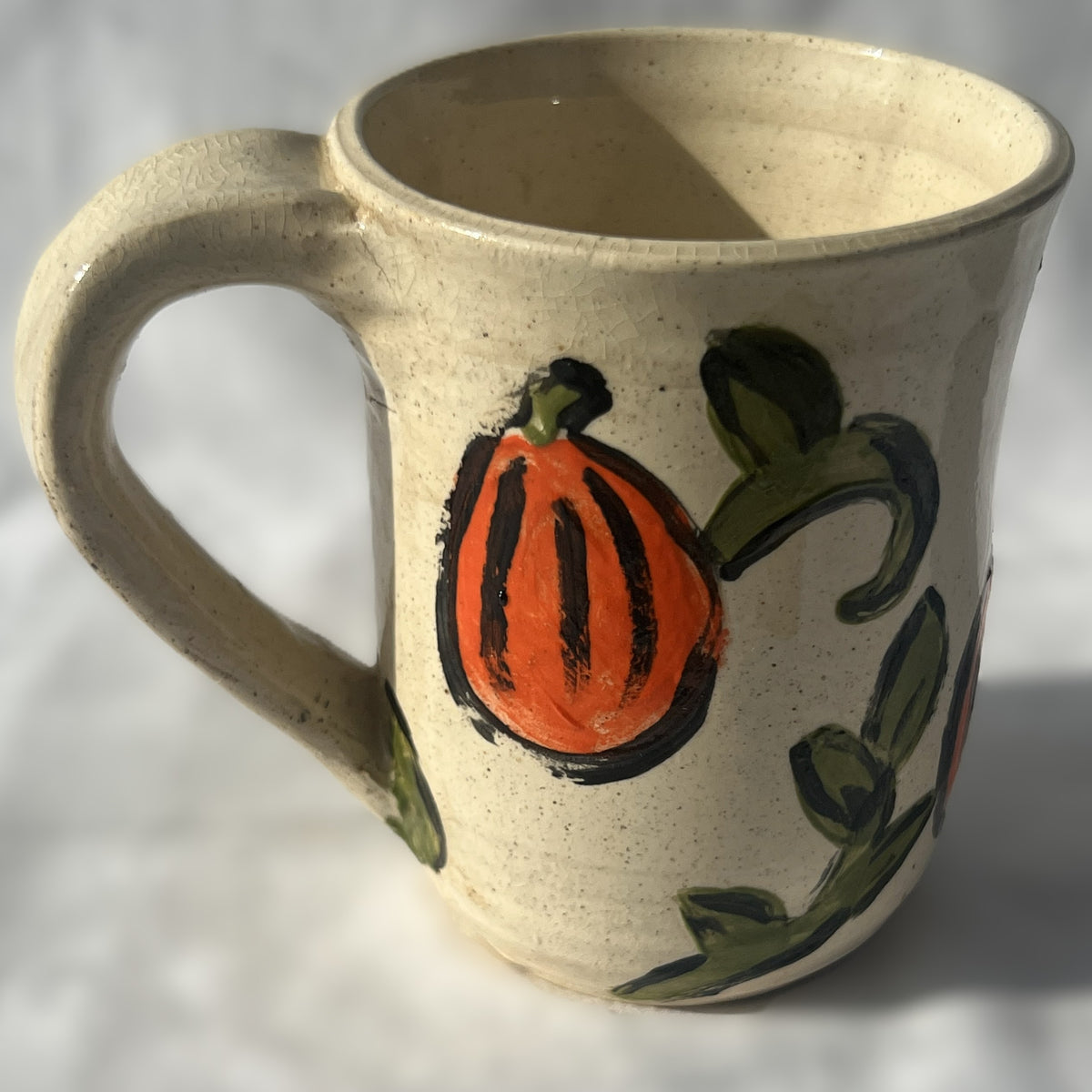 White Ceramic Mug with a Pumpkin Design