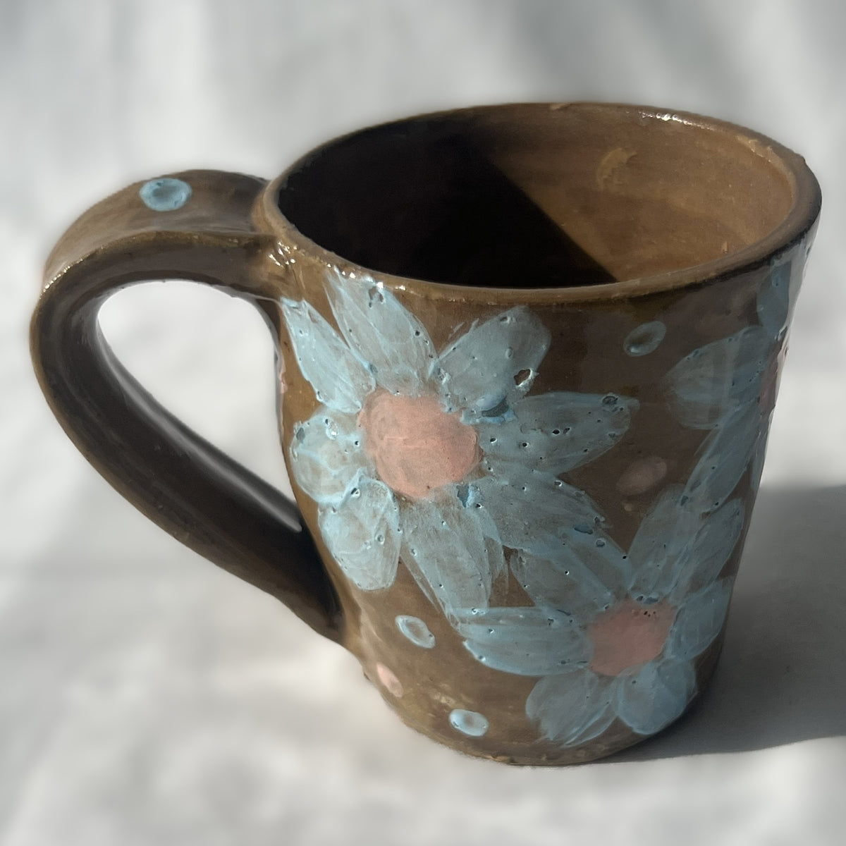 Brown Ceramic Mug with Blue Flower Design 