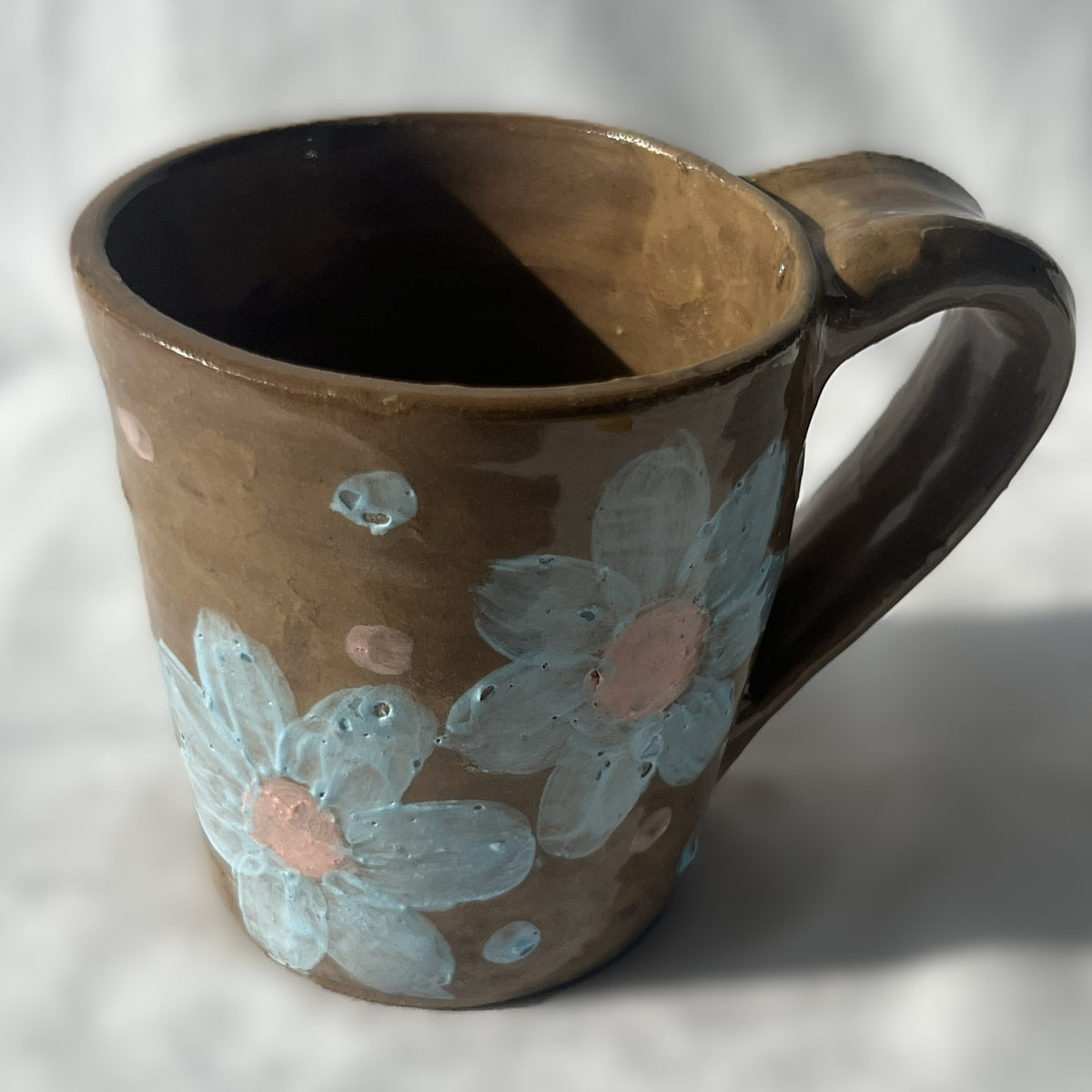 Brown Ceramic Mug with Blue Flower Design 