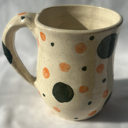 White Ceramic Mug with green and orange polka dot design