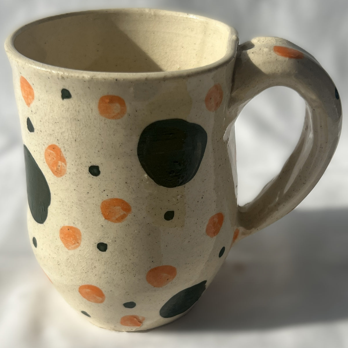 White Ceramic Mug with green and orange polka dot design